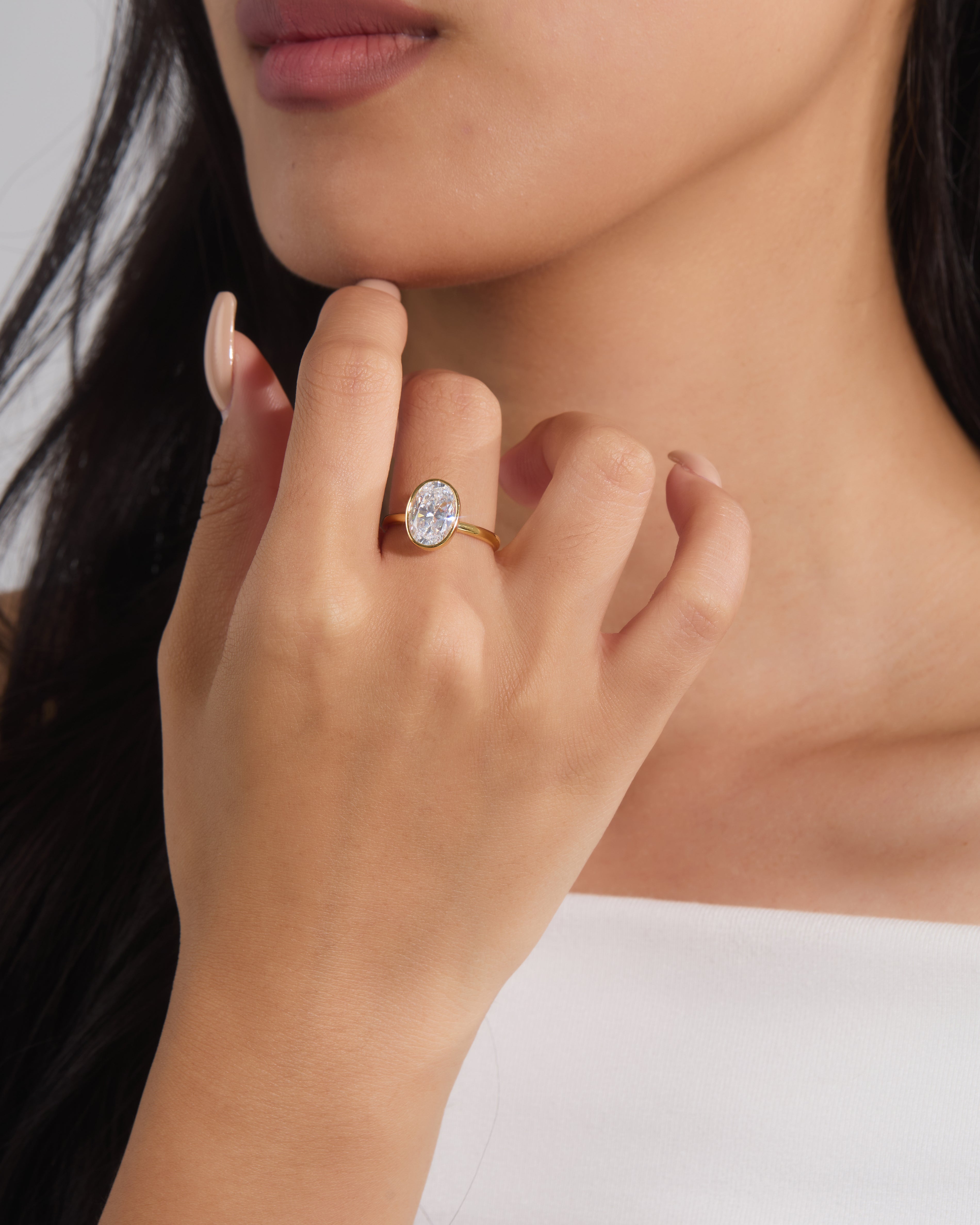 Oval Cut Bezel Set Solitaire Ring