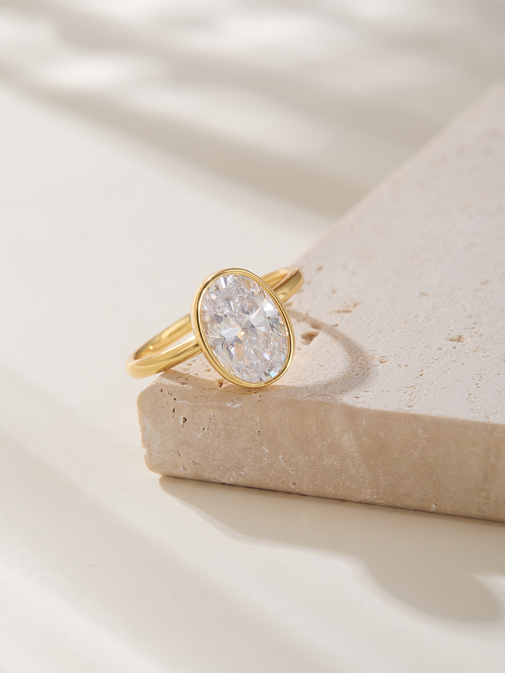 Oval Cut Bezel Set Solitaire Ring